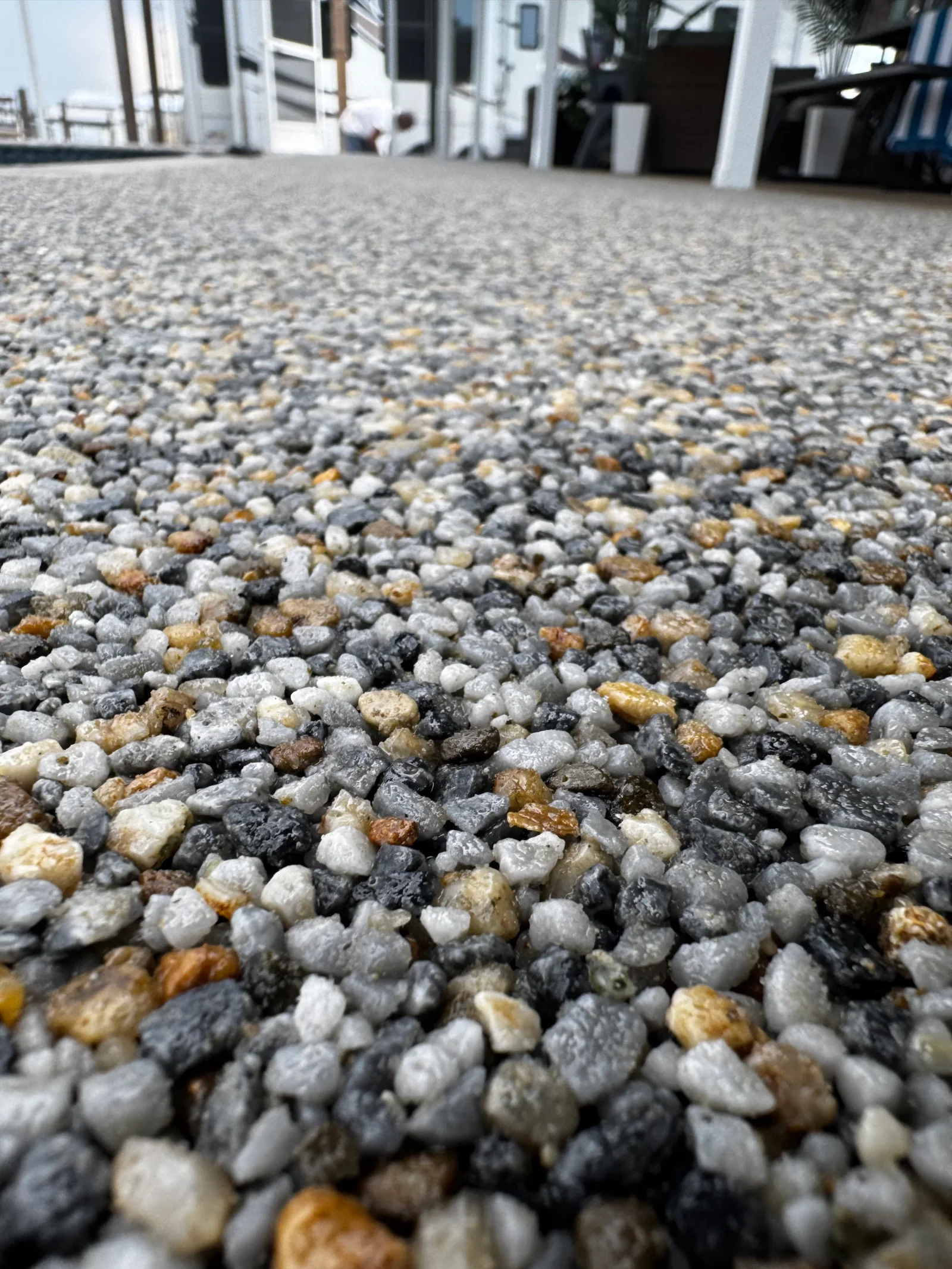 Polished concrete with exposed gray, white, and golden aggregate stones